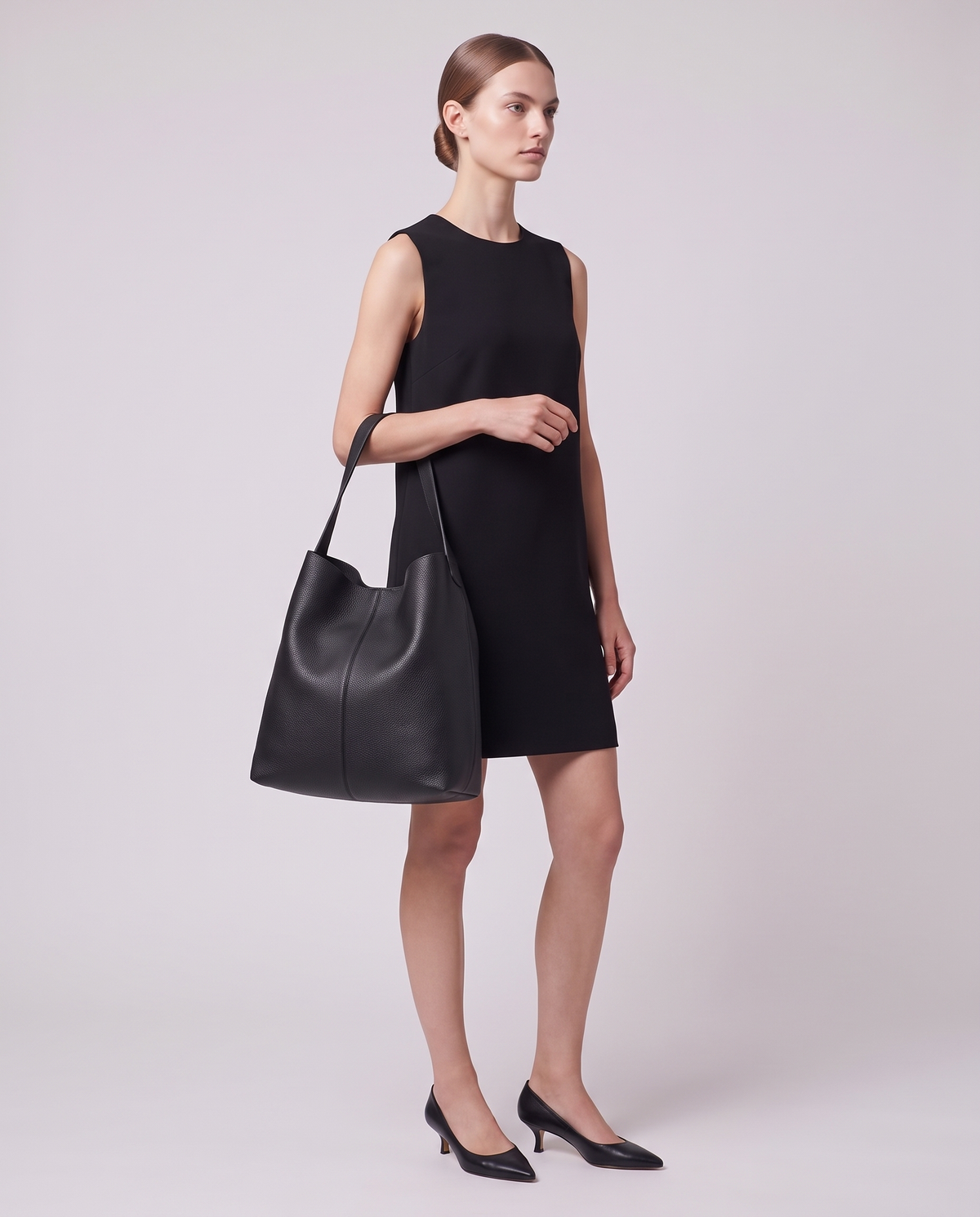 Model carrying the Valentina Tela Small bag in Black