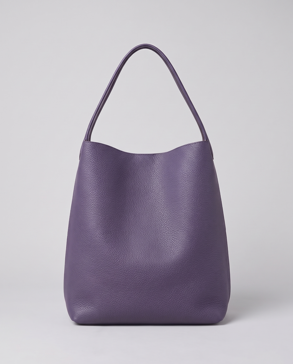 Hardware and handle detail on the Valentina Tela Small bag in Purple