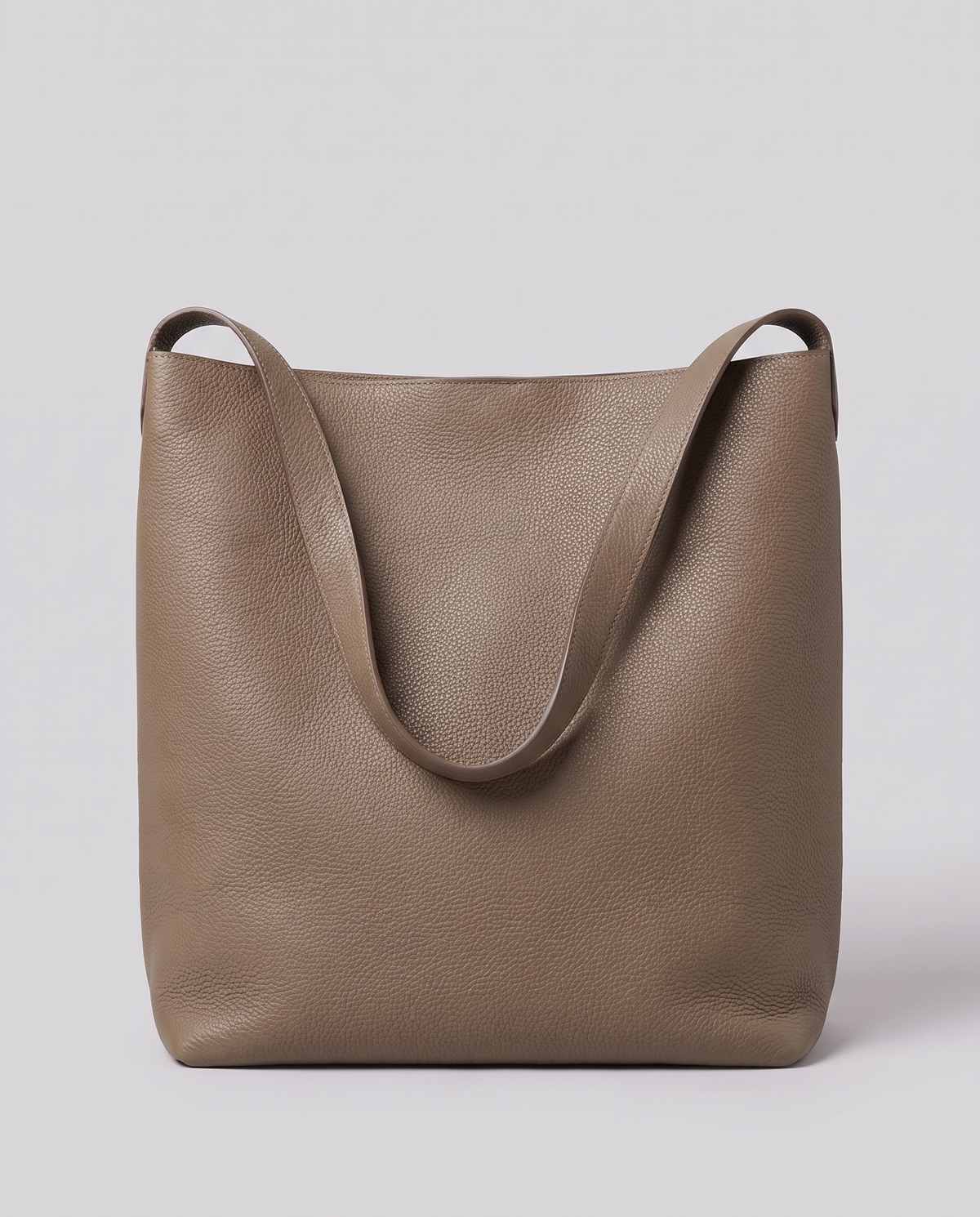 Hardware and handle detail on the Valentina Tela Small bag in Taupe