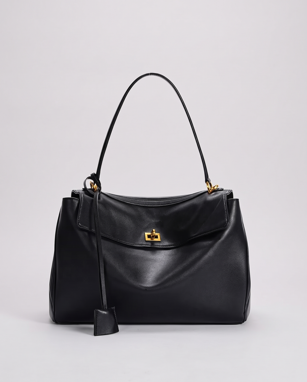 Hardware and handle detail on the Valentina Tinto Large bag in Black