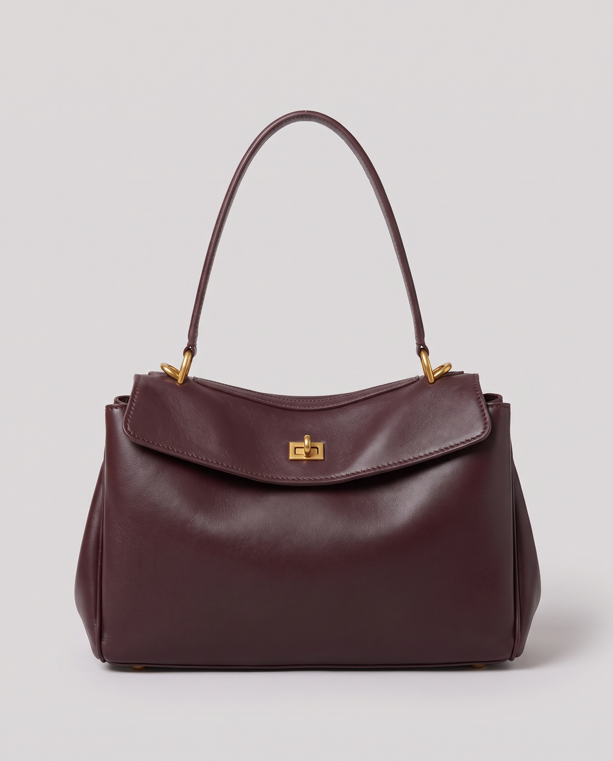 Hardware and handle detail on the Valentina Tinto Large bag in Mahogany