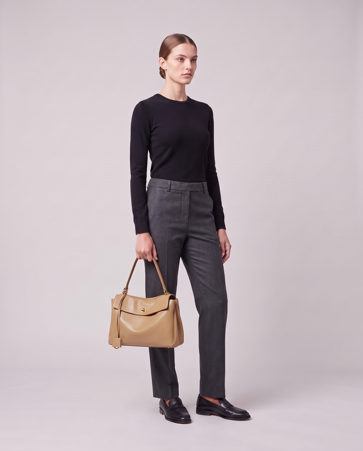 Model holding the Valentina Tinto Small bag in Tan, full length