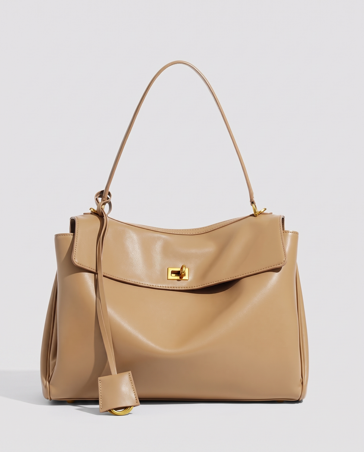 Hardware and handle detail on the Valentina Tinto Small bag in Tan