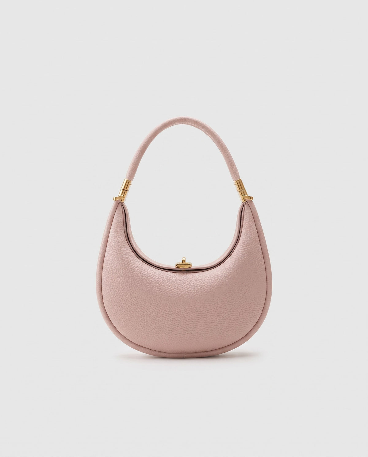 Todi pebbled leather crescent bag in Blush – front view
