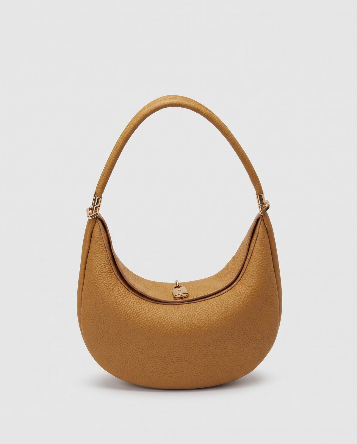 Todi pebbled leather crescent bag in Caramel – front view