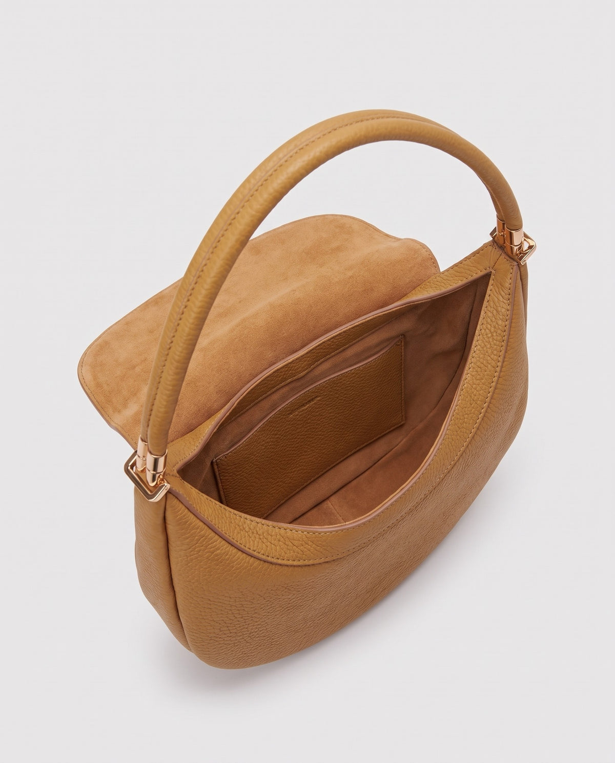 Inside view of the Todi crescent bag in Caramel