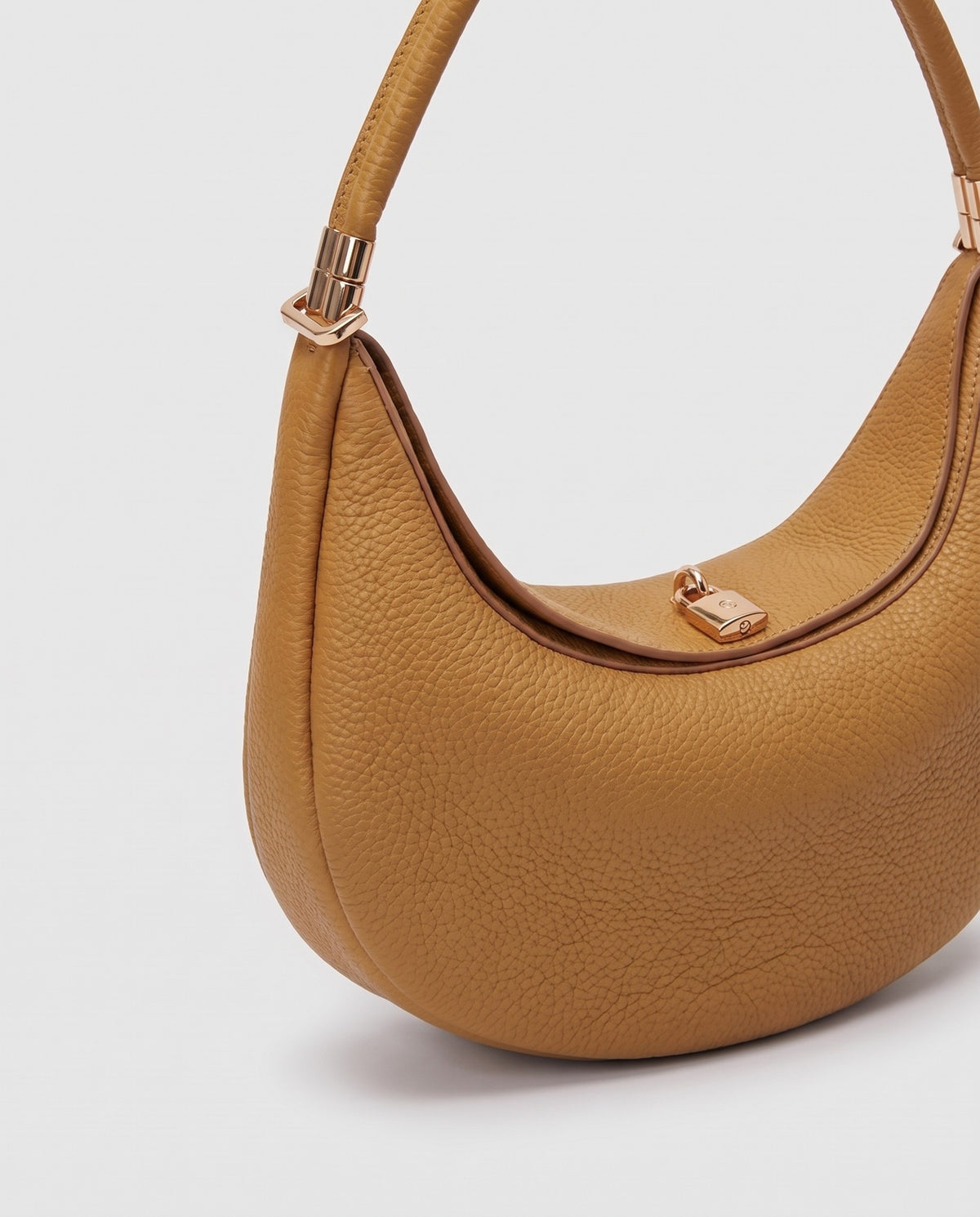 Close-up of the pebbled cowhide leather on the Todi bag in Caramel