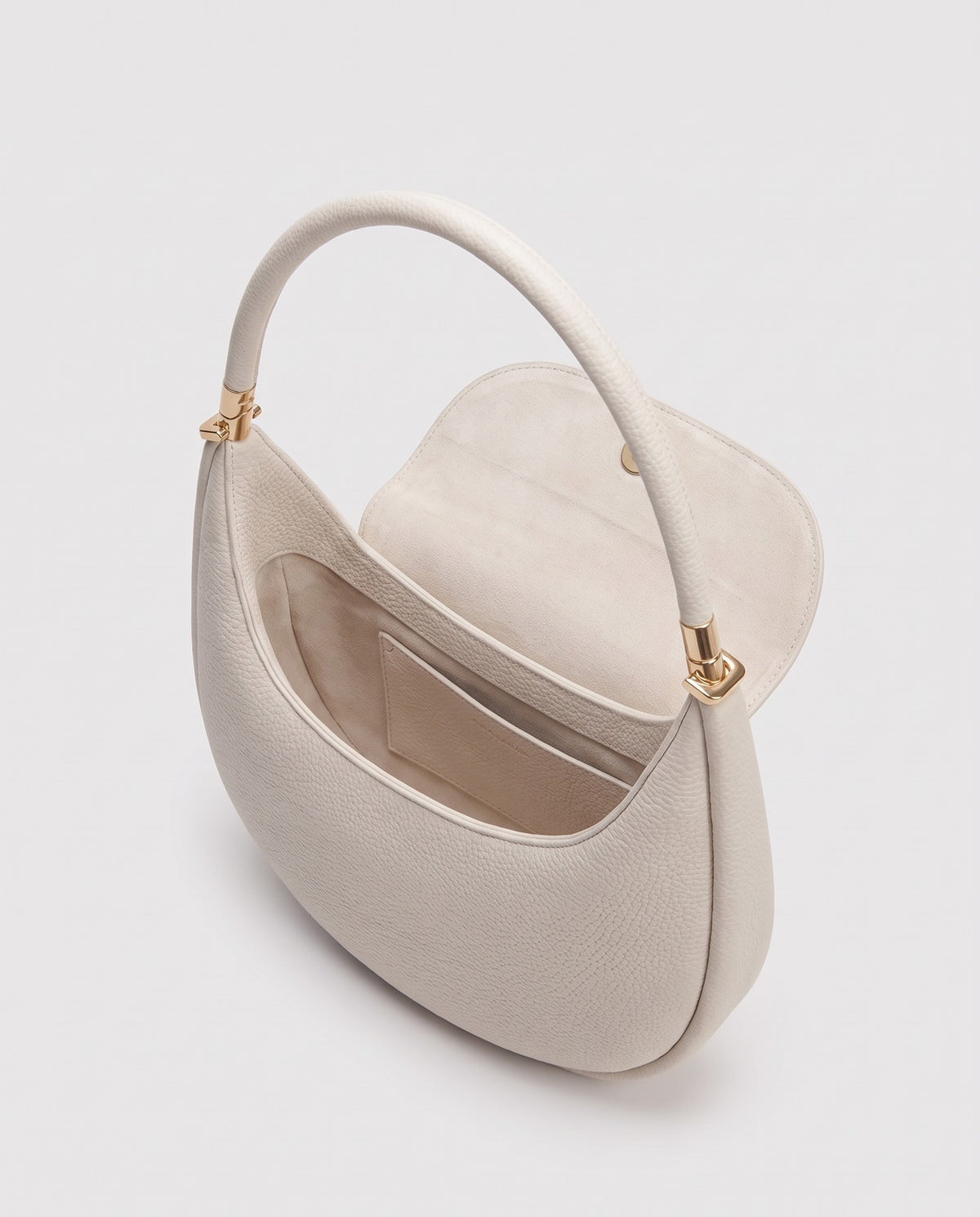 Inside view of the Todi crescent bag in Ivory