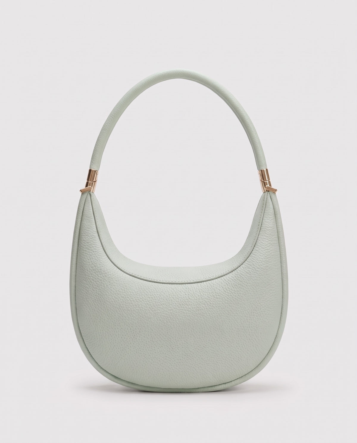 Todi pebbled leather crescent bag in Mint – back view