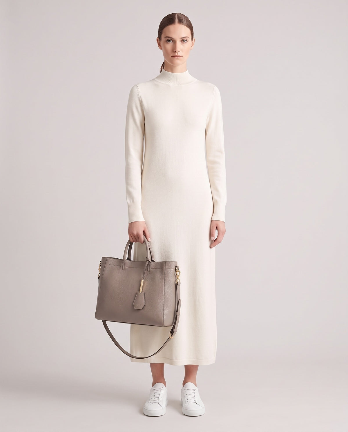 Torre Large leather tote in Grey – model holding it, full length