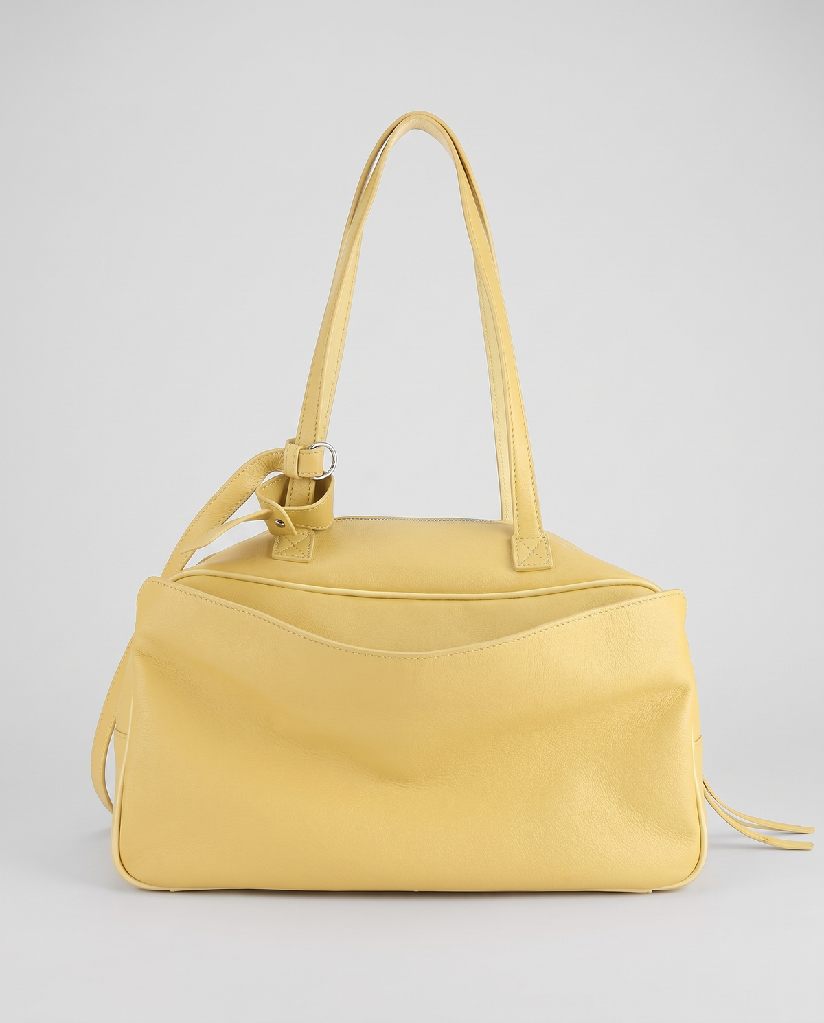 Hardware and handle detail on the Valentina Treviso Large bag in Butter