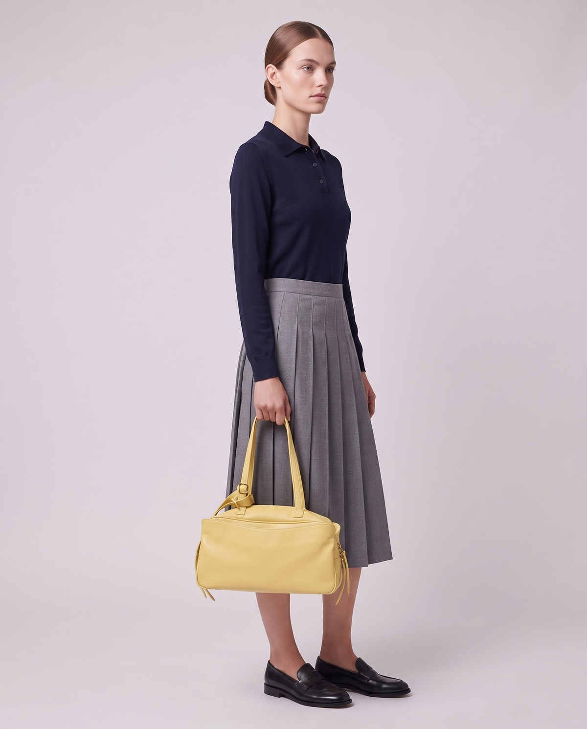 Model carrying the Valentina Treviso Large bag in Butter