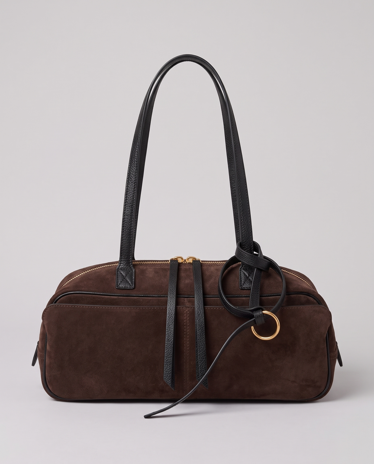 Hardware and handle detail on the Valentina Umbra Large bag in Chocolate