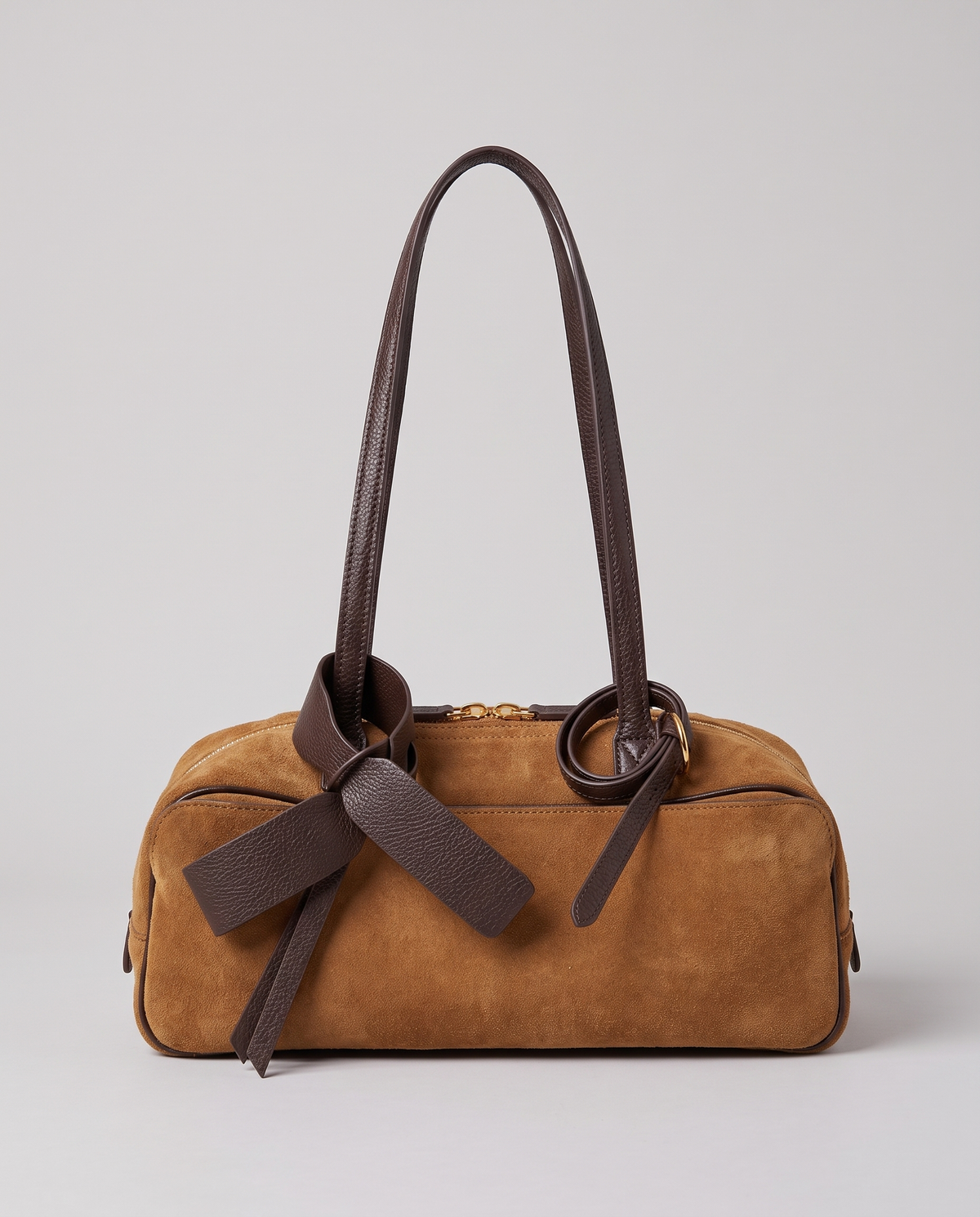 Hardware and handle detail on the Valentina Umbra Small bag in Camel