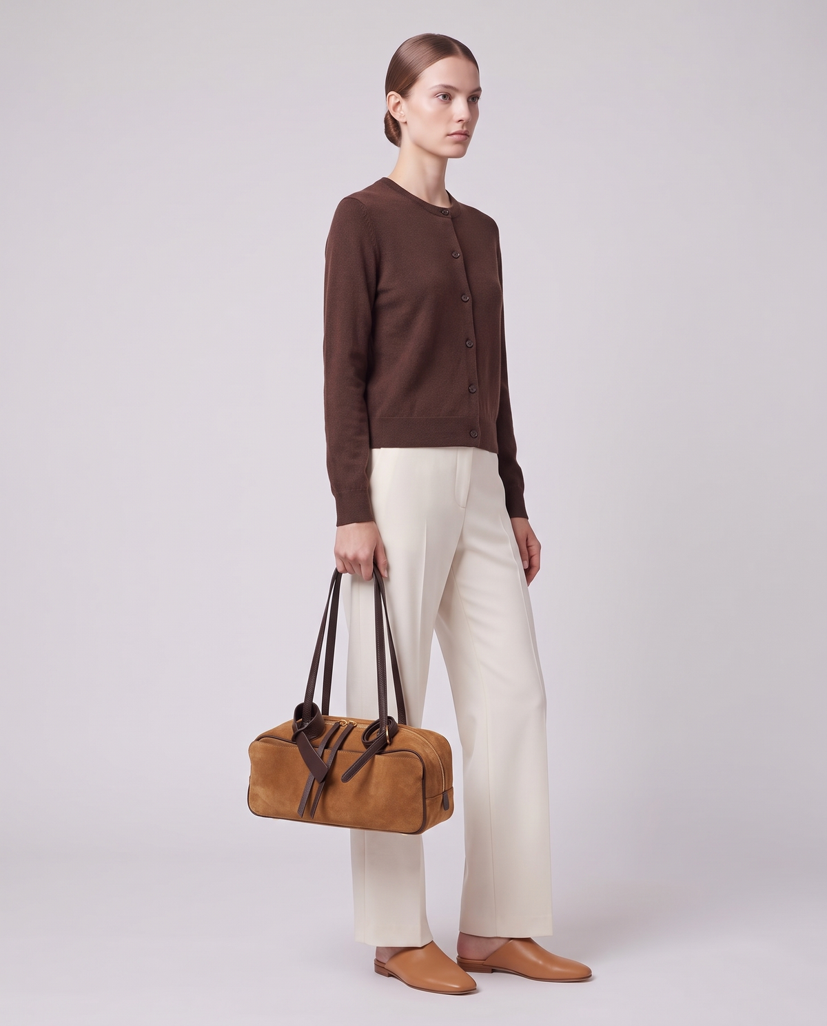 Model carrying the Valentina Umbra Small bag in Camel