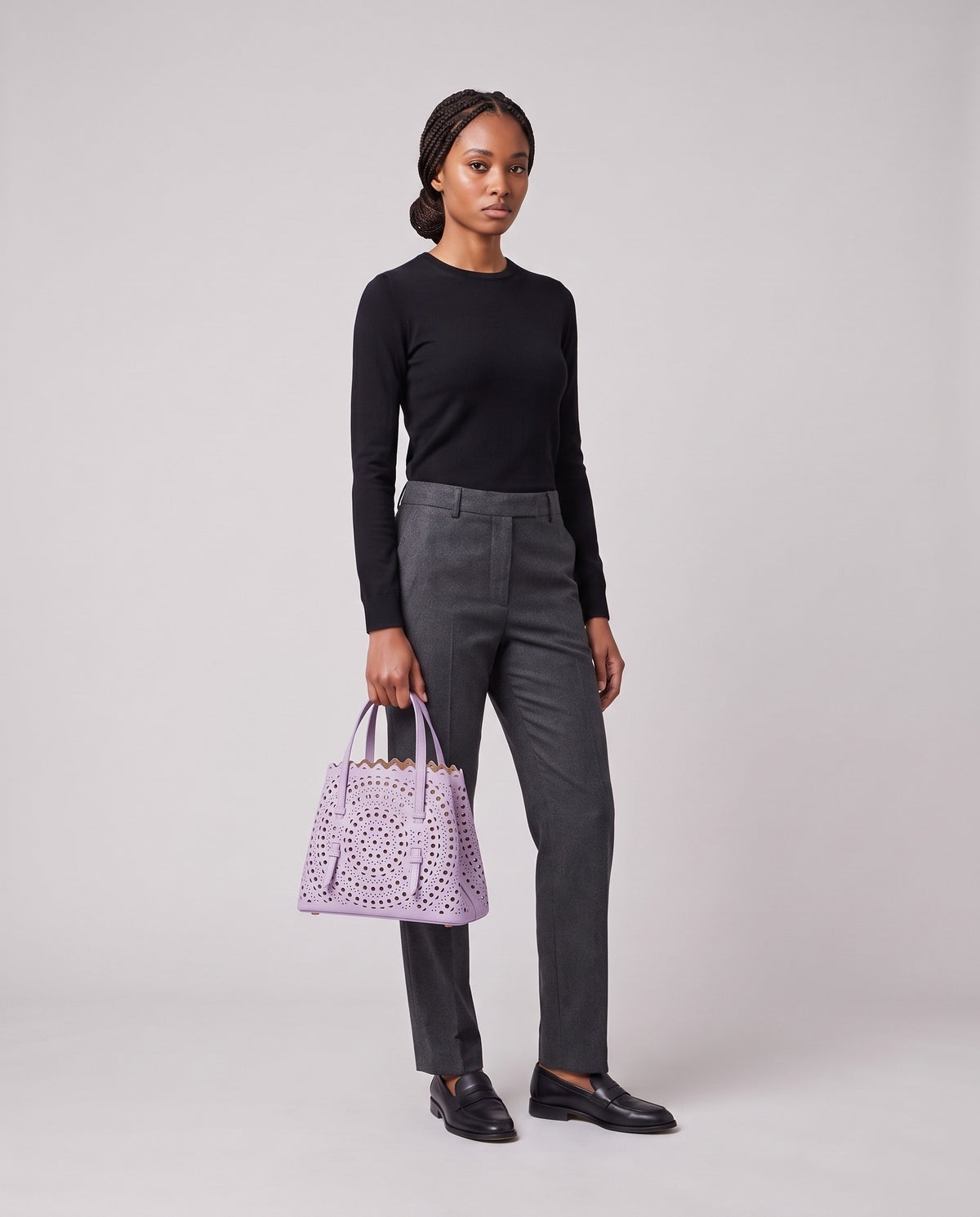 Model holding the Valentina Urbino Large bag in Lavender, full length
