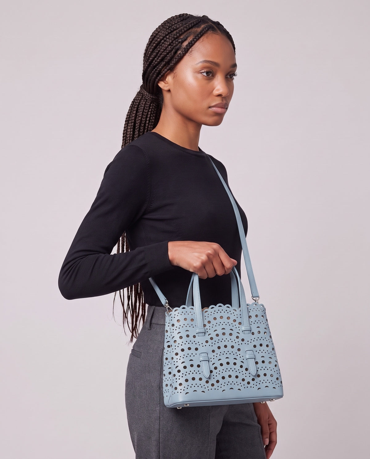 Model carrying the Valentina Urbino Large bag in Sky