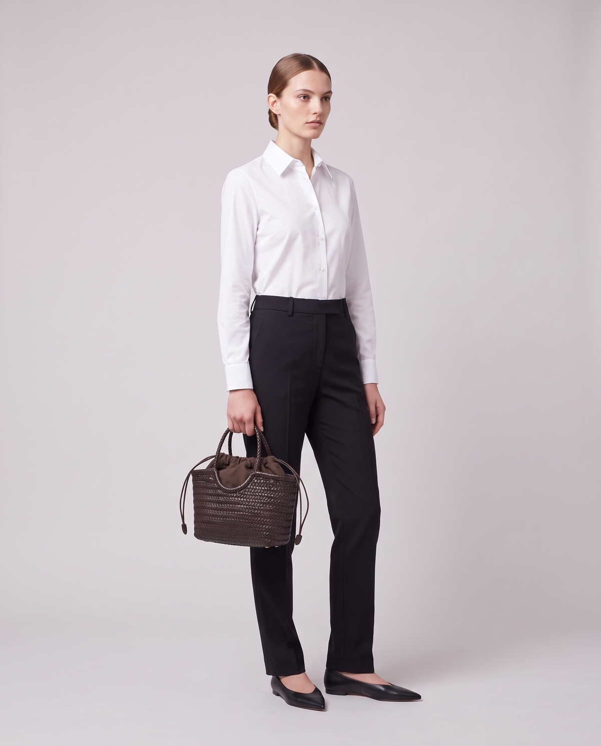 Model carrying the Valentina Gubbio bag in Chocolate
