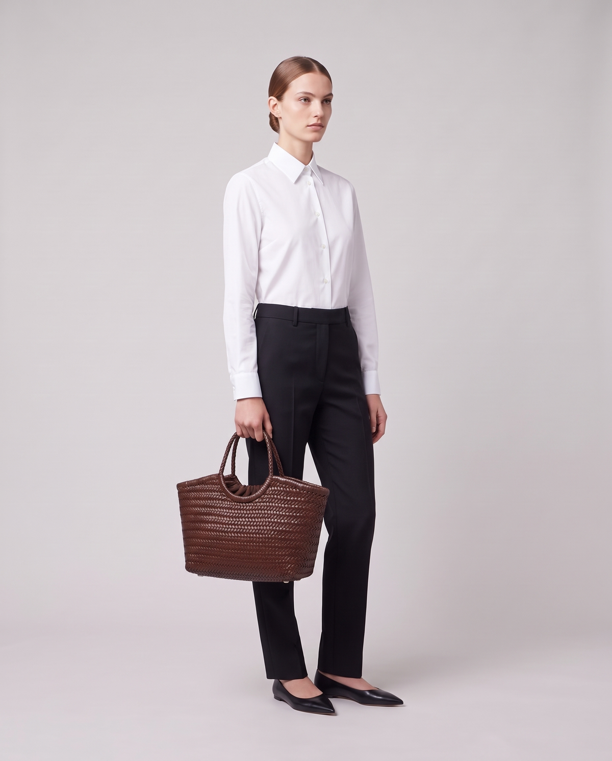 Model carrying the Valentina Matera Large bag in Chocolate
