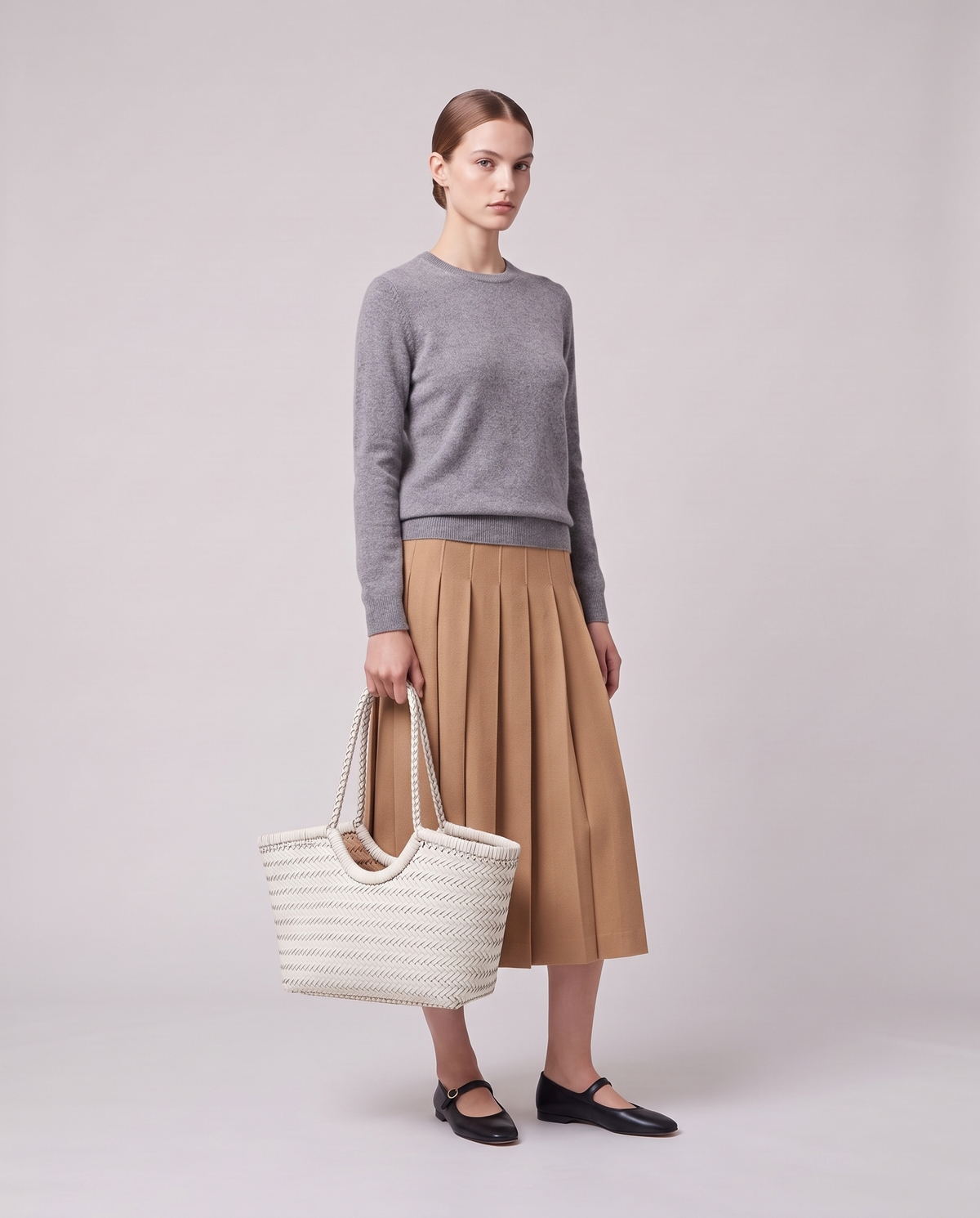 Model holding the Valentina Matera Large bag in White, full length