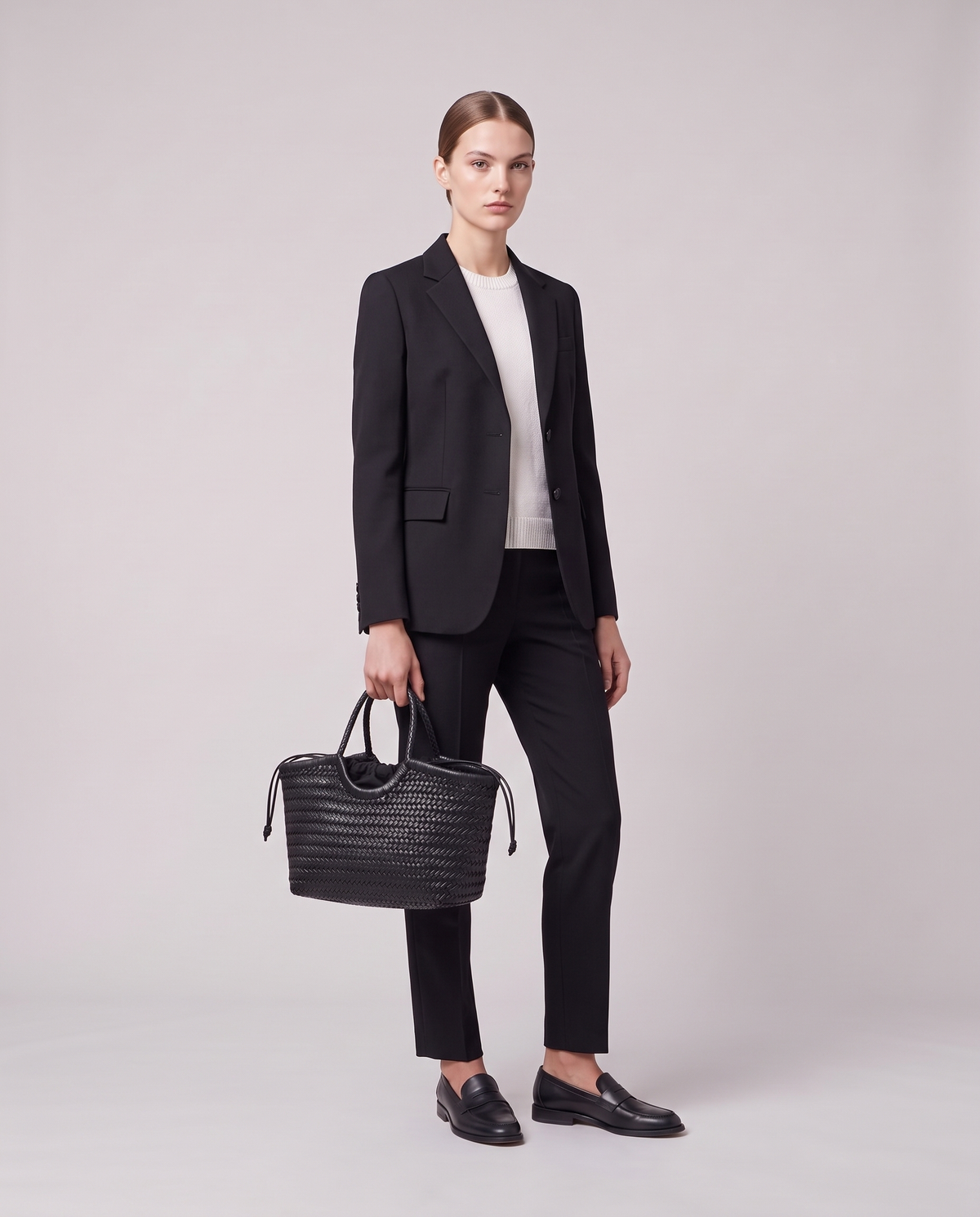 Model holding the Valentina Matera Small bag in Black, full length