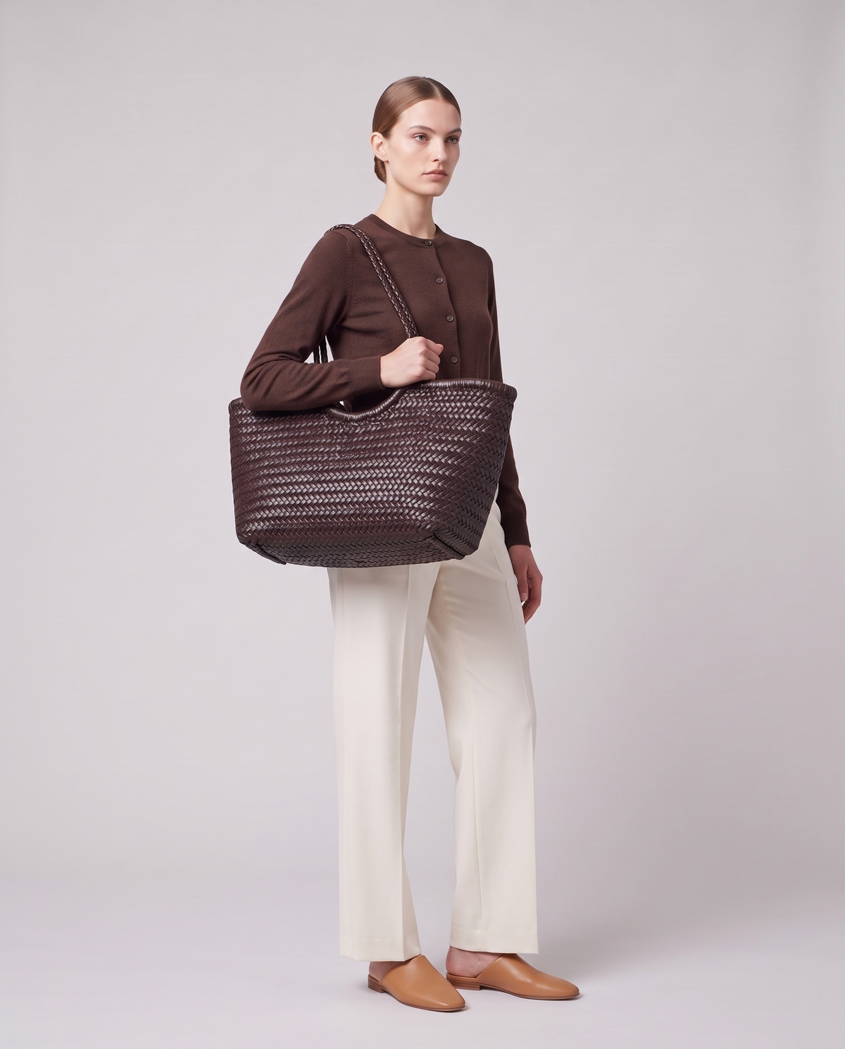 Model carrying the Valentina Noto Large bag in Chocolate