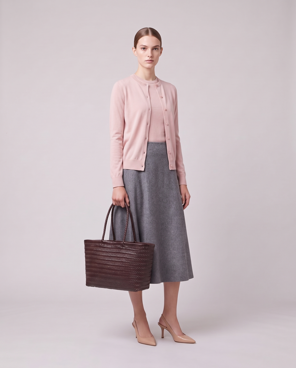 Model holding the Valentina Noto Small bag in Burgundy, full length
