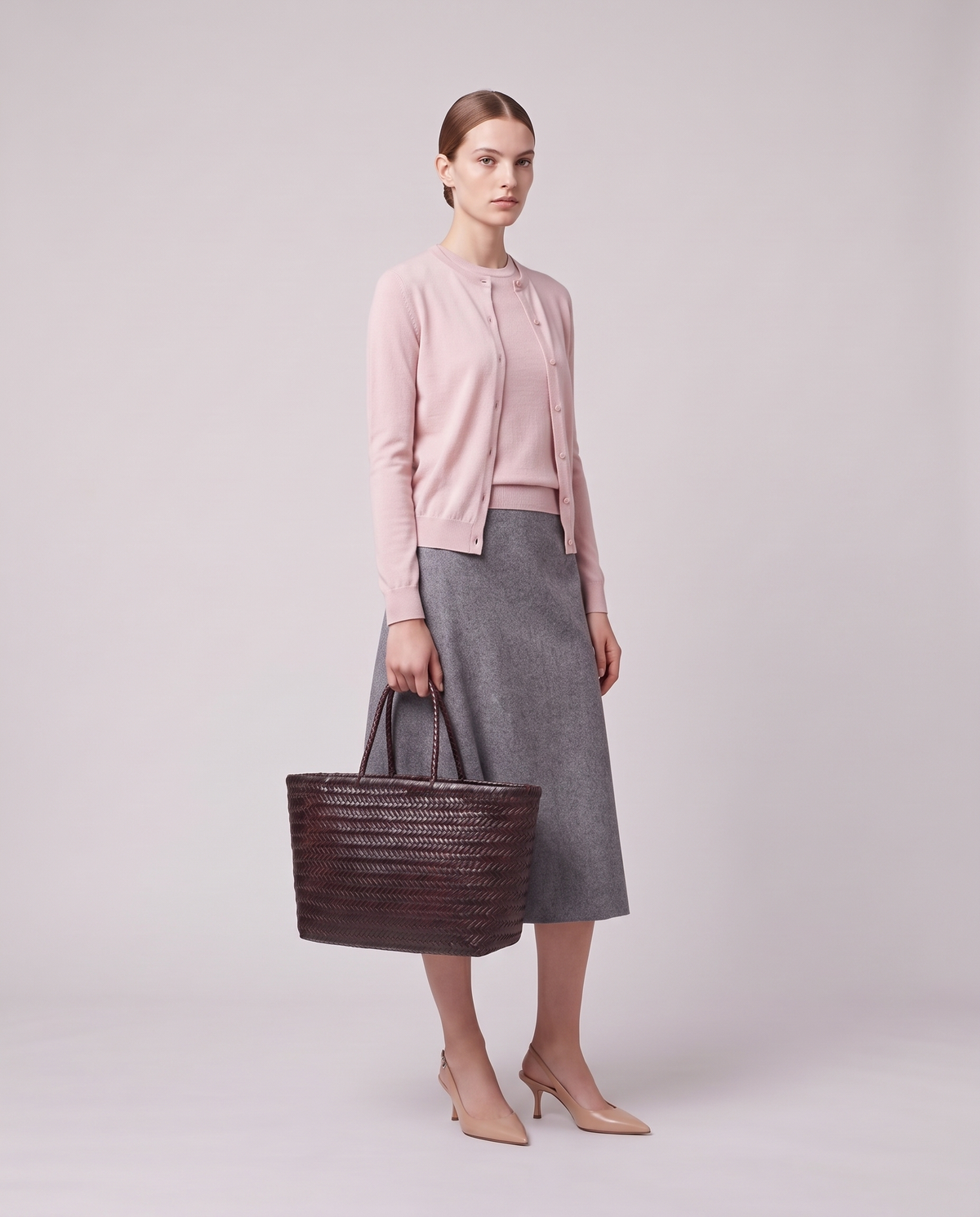 Model holding the Valentina Noto Small bag in Espresso, full length