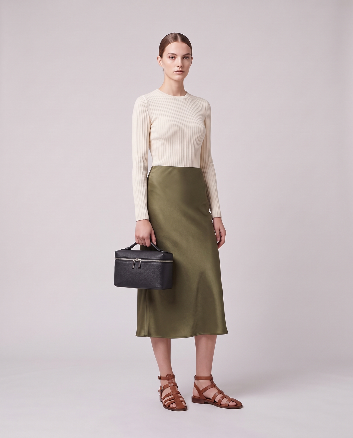 Model holding the Valentina Orvieto Small top-handle bag in Pink leather, full length