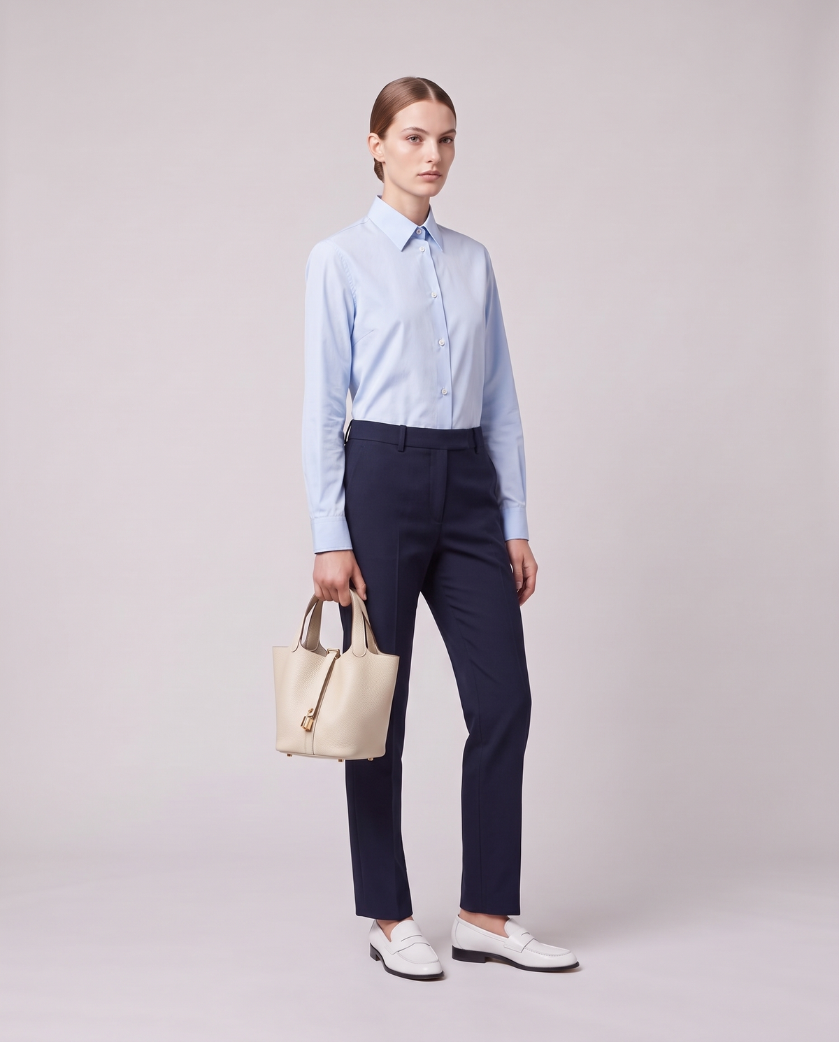 Model holding the Valentina Ostuni Large bag in Ivory, full length