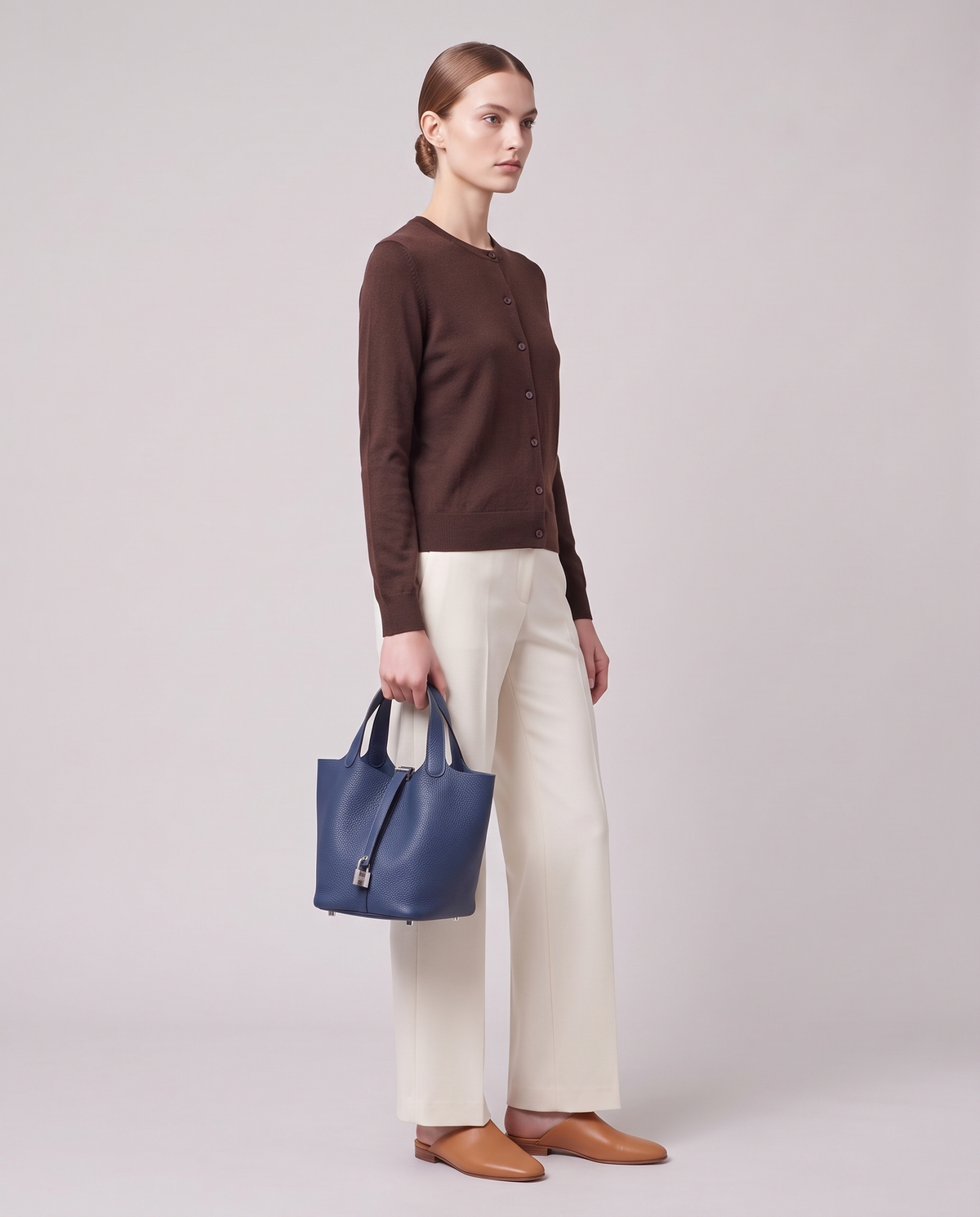 Model carrying the Valentina Ostuni Large bag in Navy