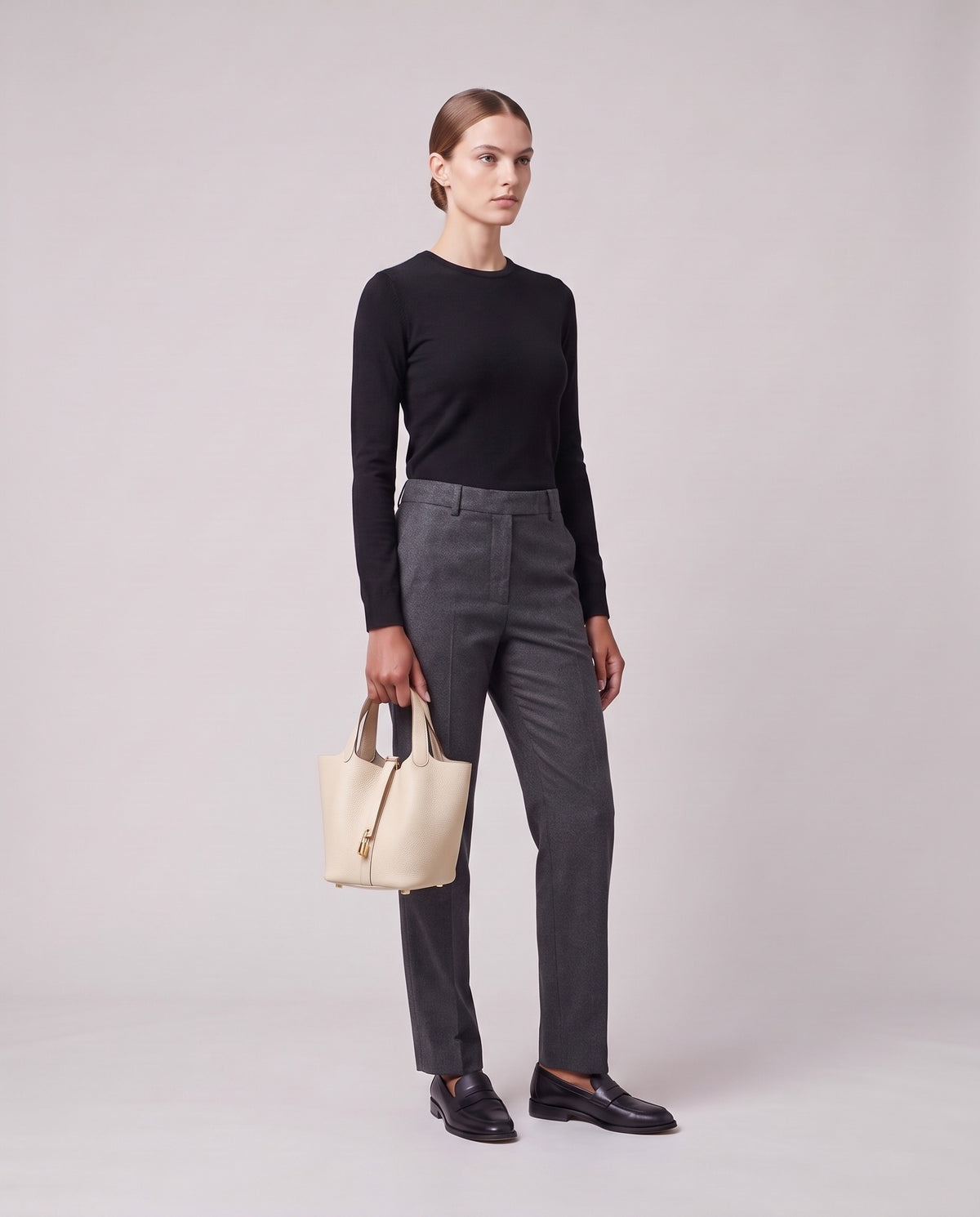 Model holding the Valentina Ostuni Small bag in Cream, full length