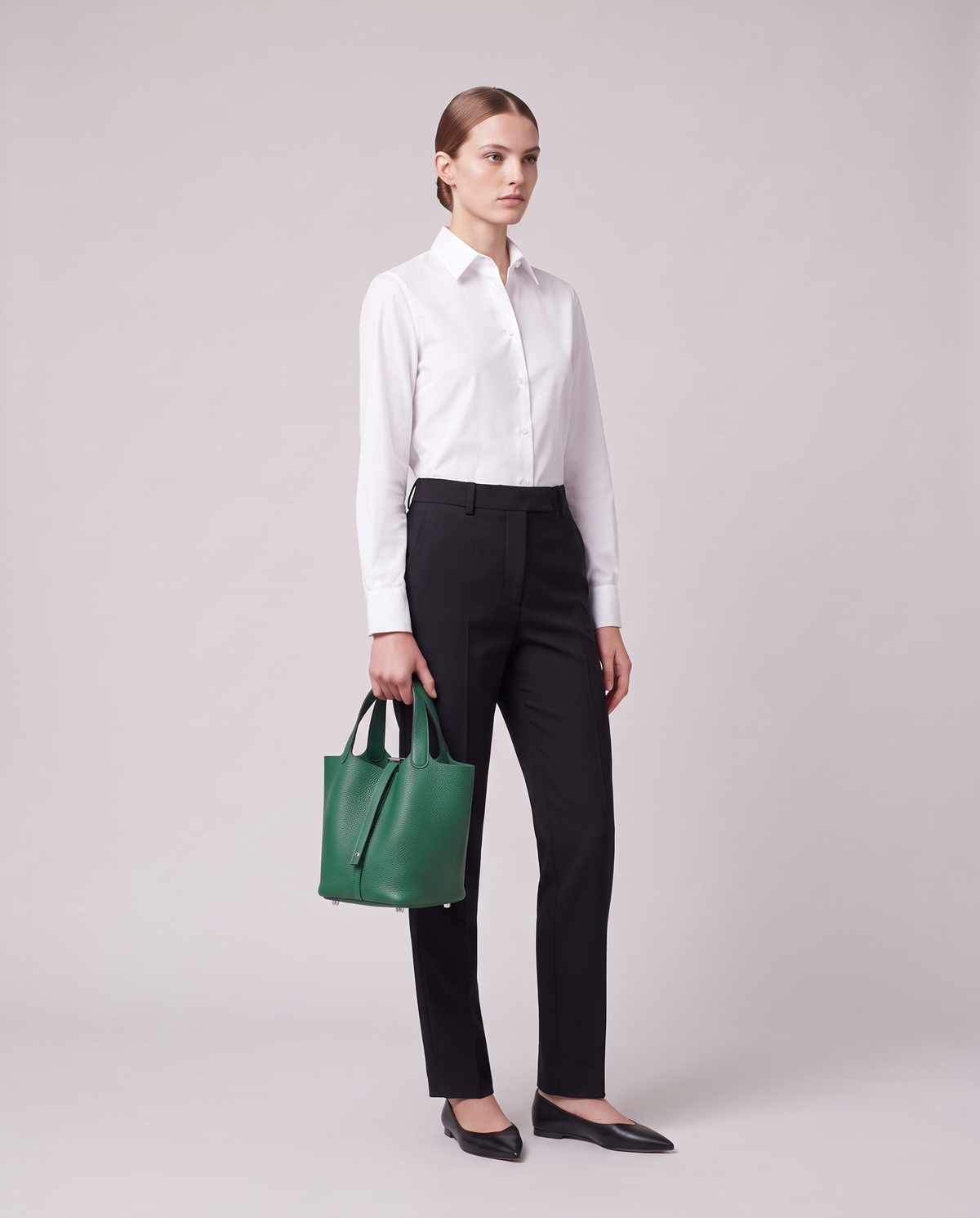 Model carrying the Valentina Ostuni Small bag in Emerald