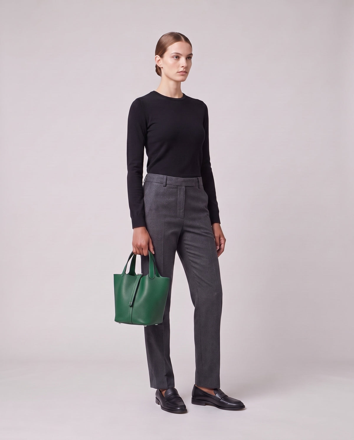 Model holding the Valentina Ostuni Small bag in Emerald, full length