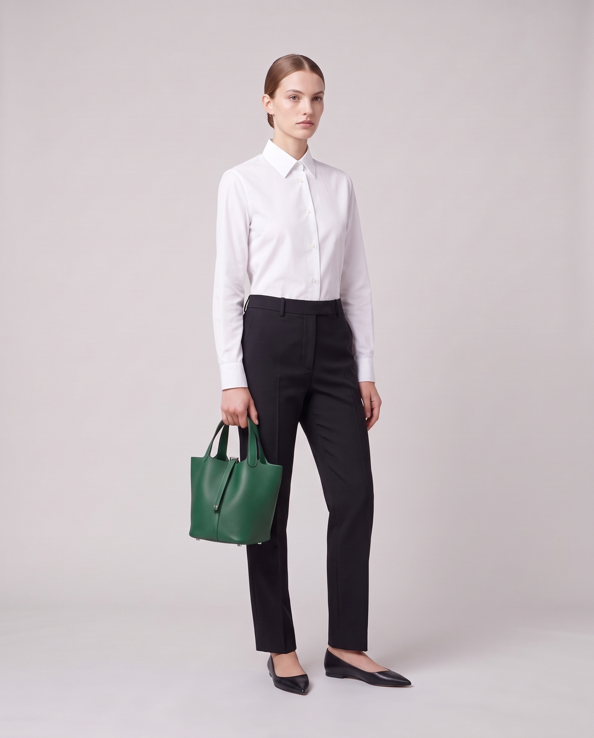 Model holding the Valentina Ostuni Small bag in Emerald, full length