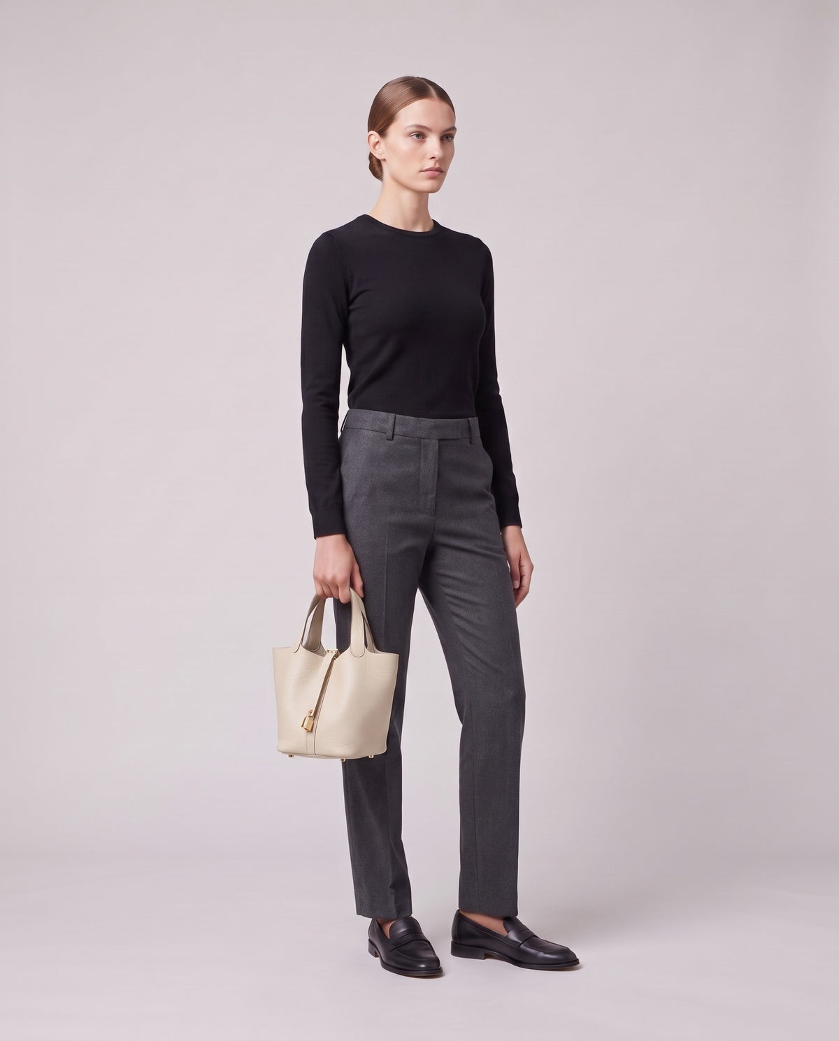 Model holding the Valentina Ostuni Small bag in Ivory, full length