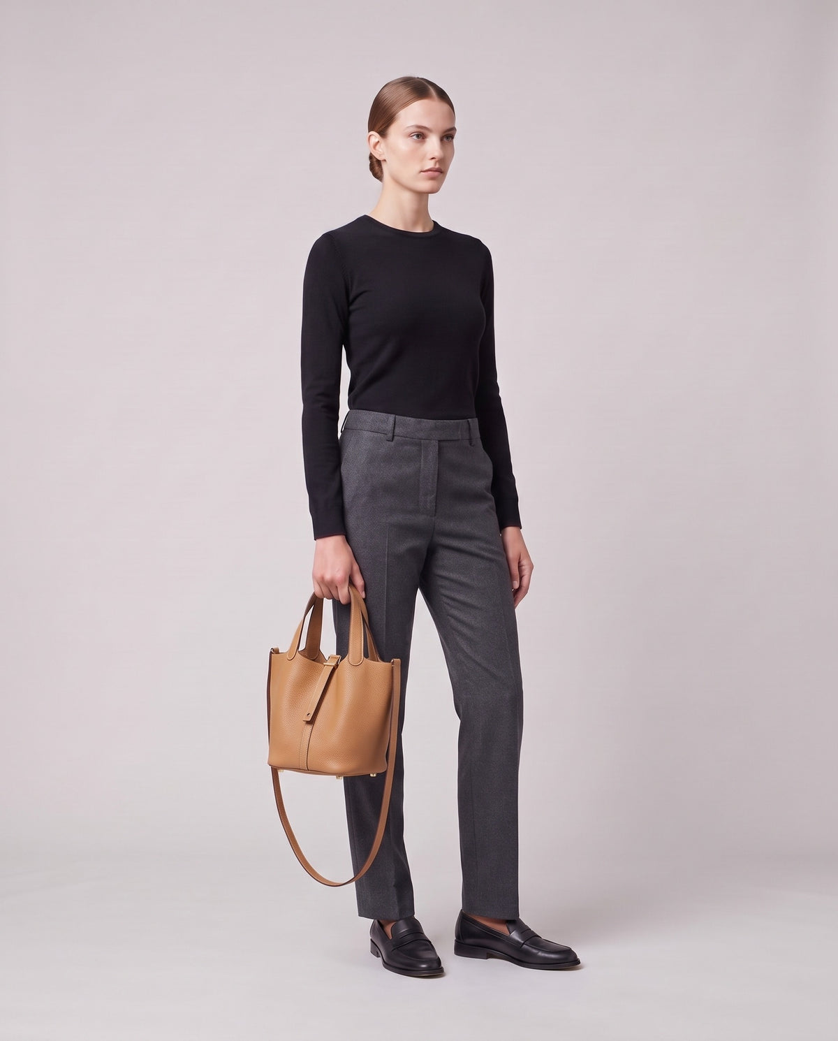 Model holding the Valentina Ostuni Small bag in Tan, full length