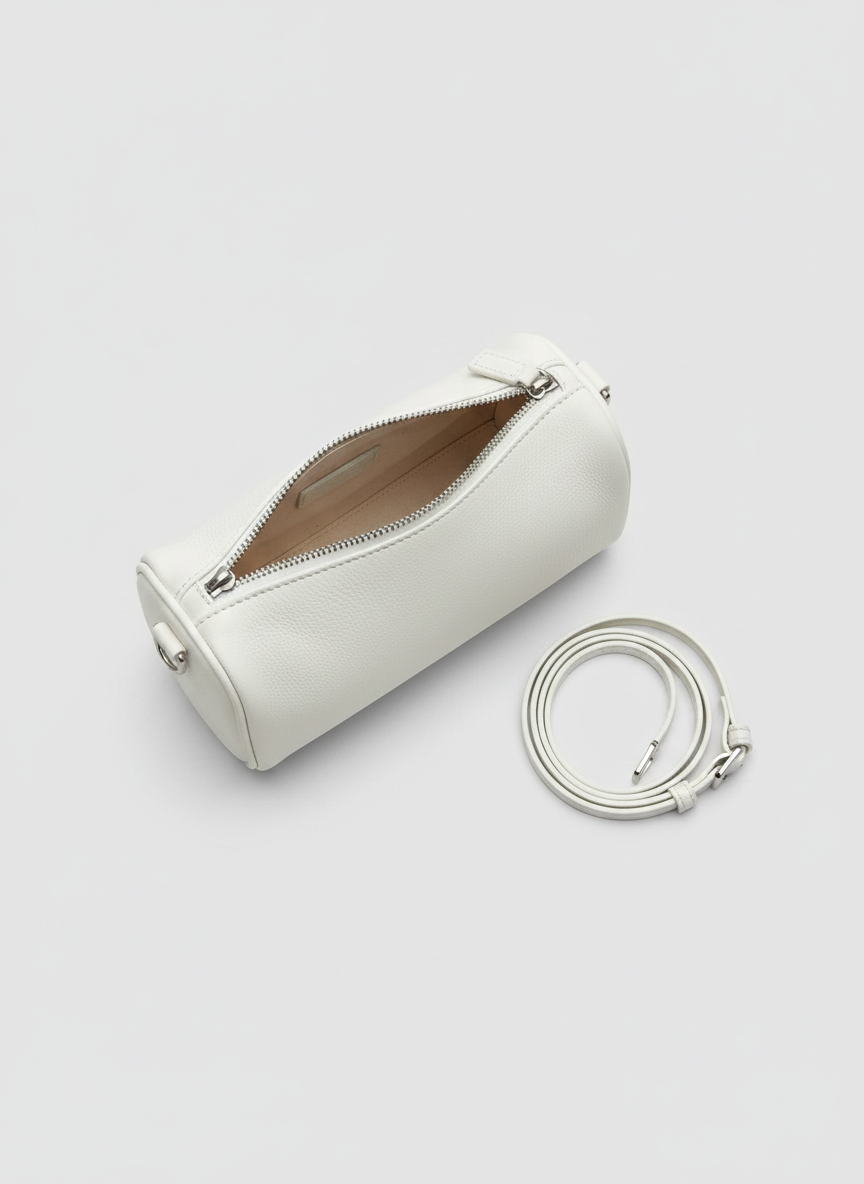 Valentina Roma barrel bag in white leather, open from above showing the interior