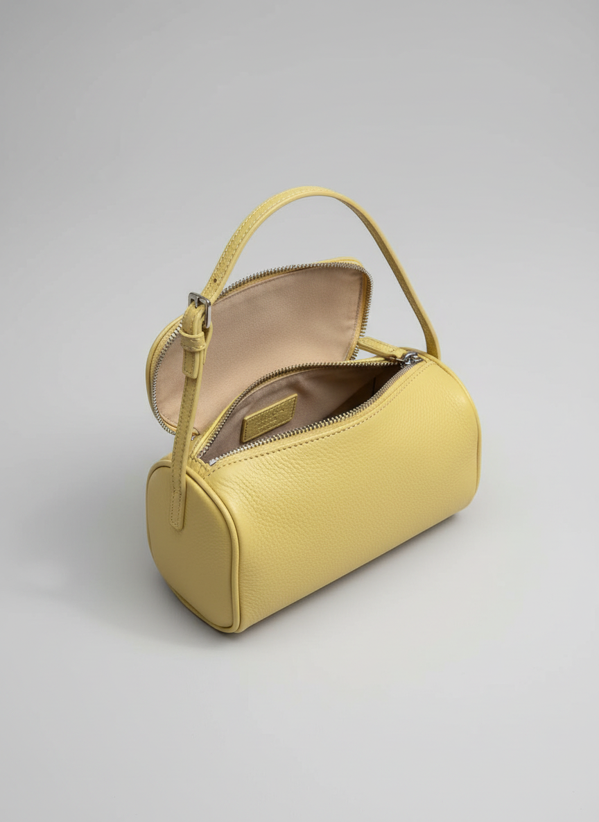 Valentina Roma barrel bag in pale yellow leather, open from above showing the interior