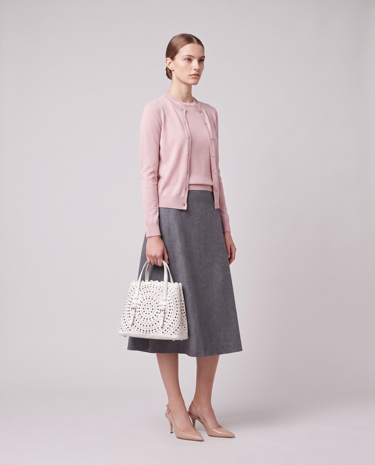 Model carrying the Valentina Urbino Large bag in White