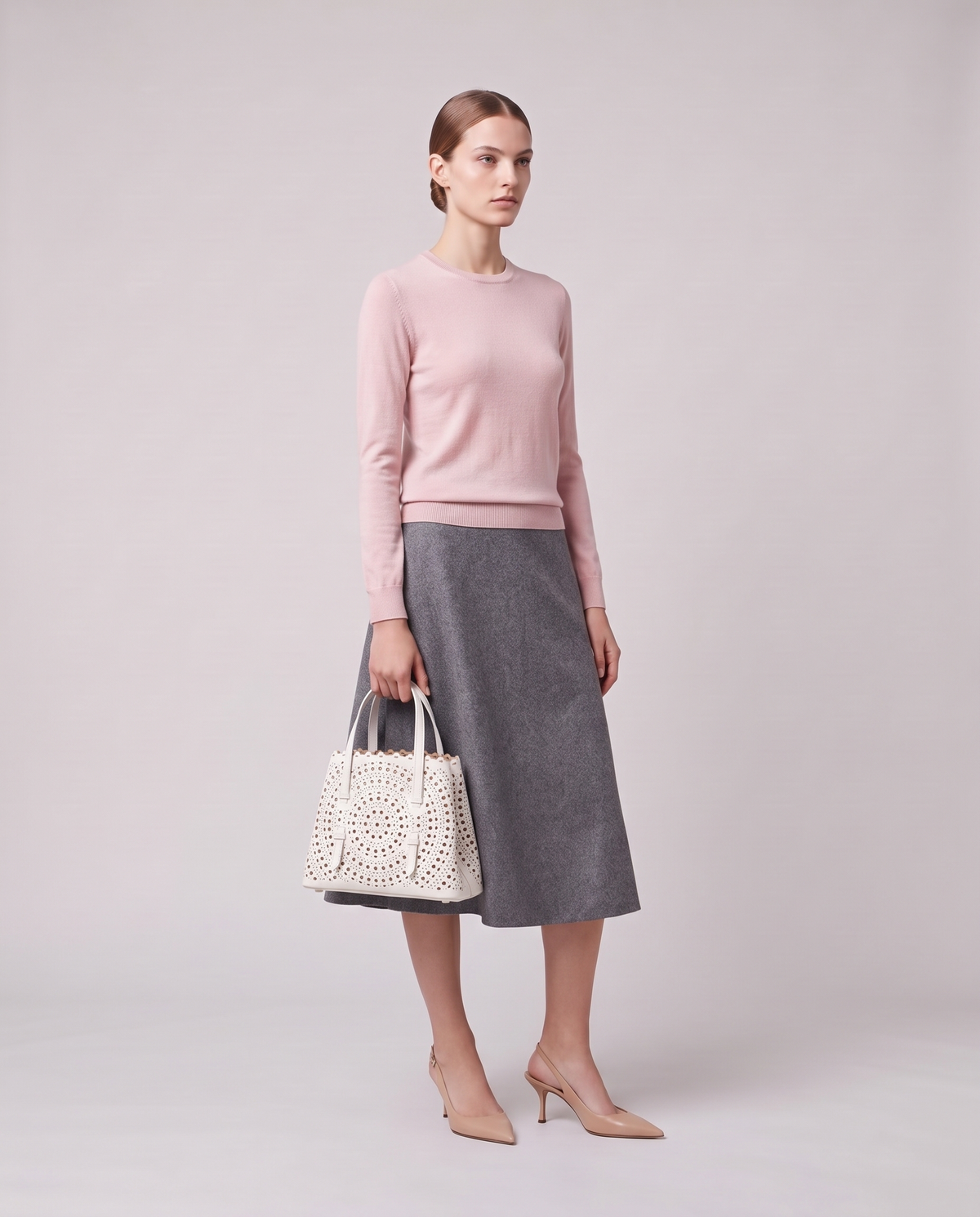 Model holding the Valentina Urbino Large bag in White, full length