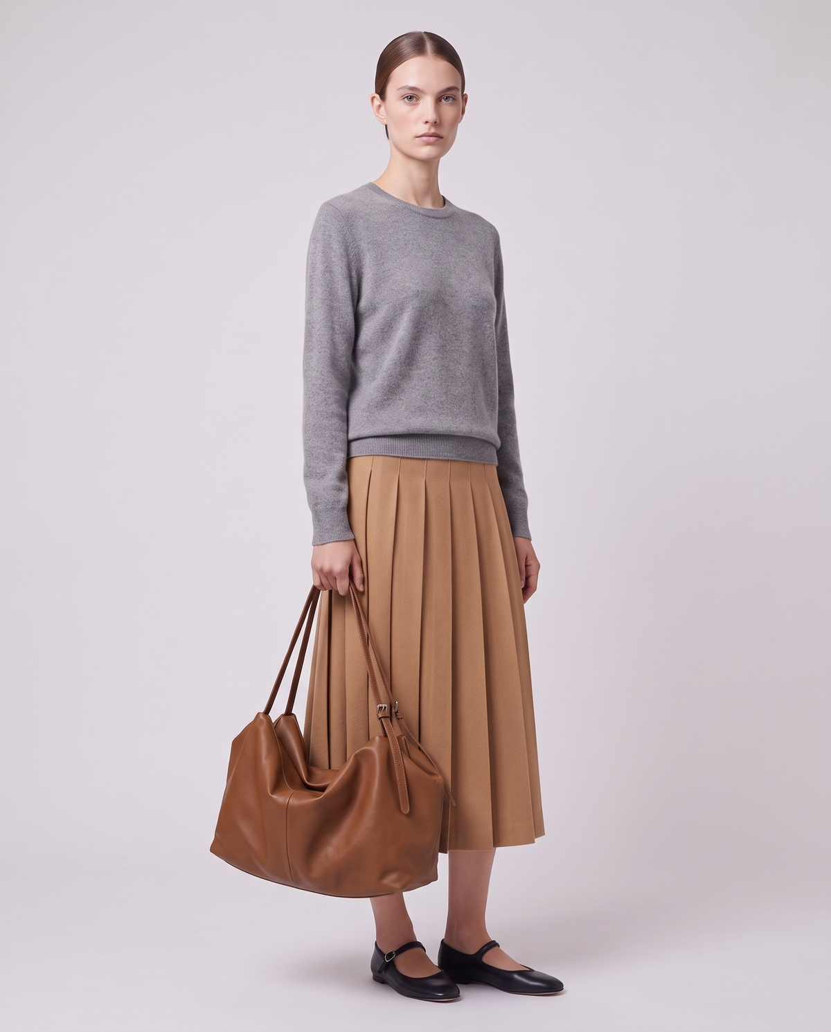 Model carrying the Valentina Velluto Small bag in Caramel