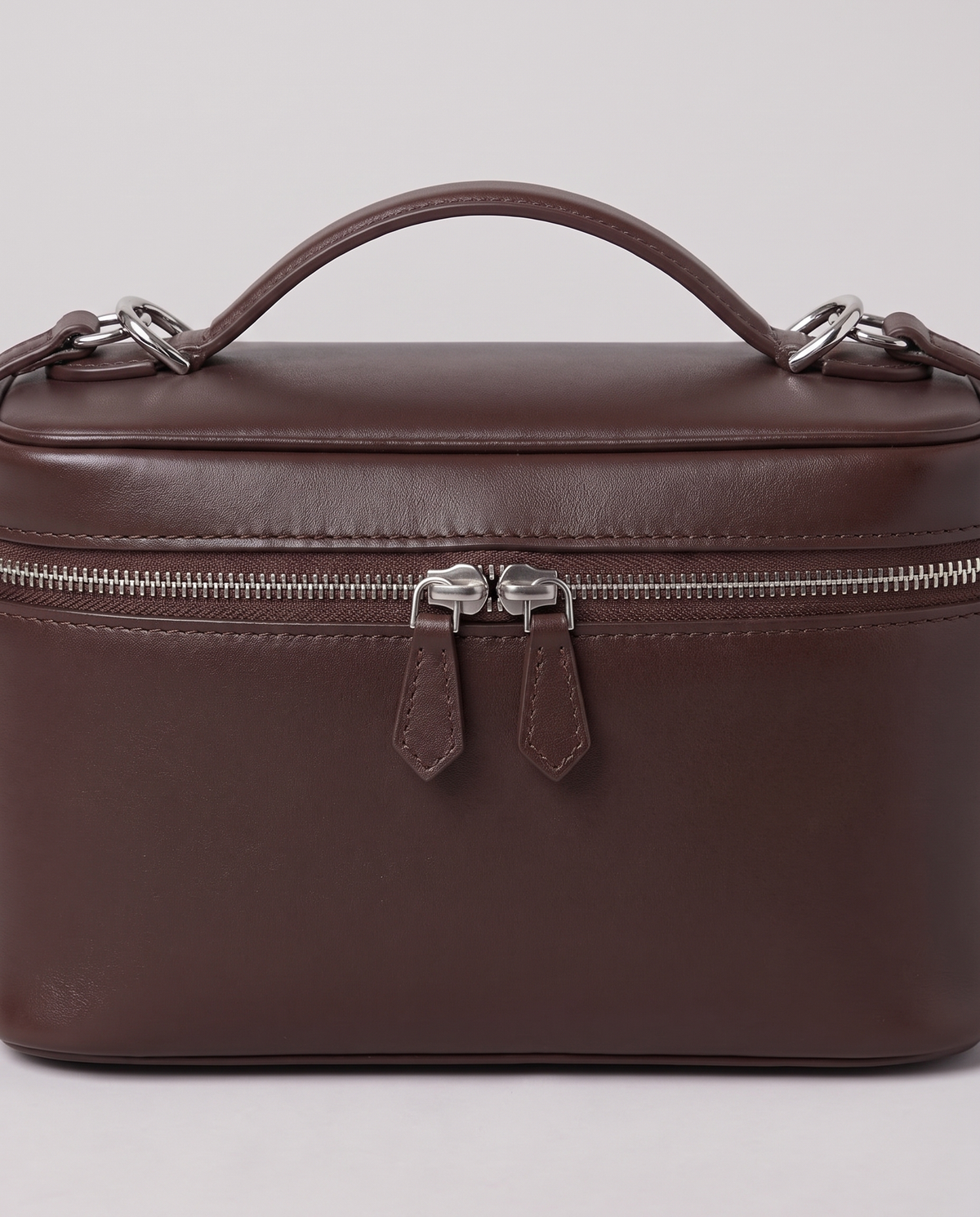 Hardware and handle detail on the Valentina Velluto Small bag in Chocolate