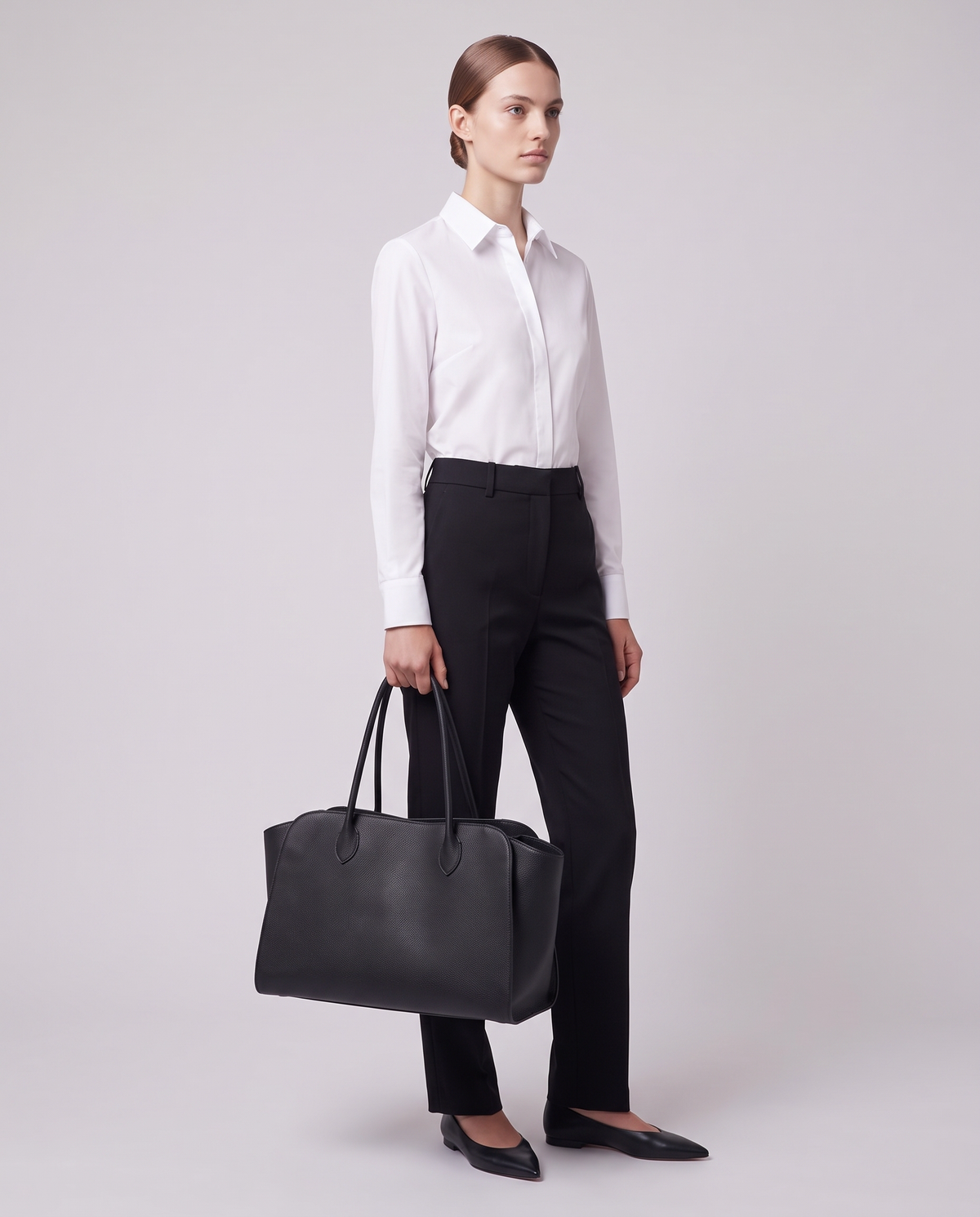 Model carrying the Valentina Volta Large bag in Black