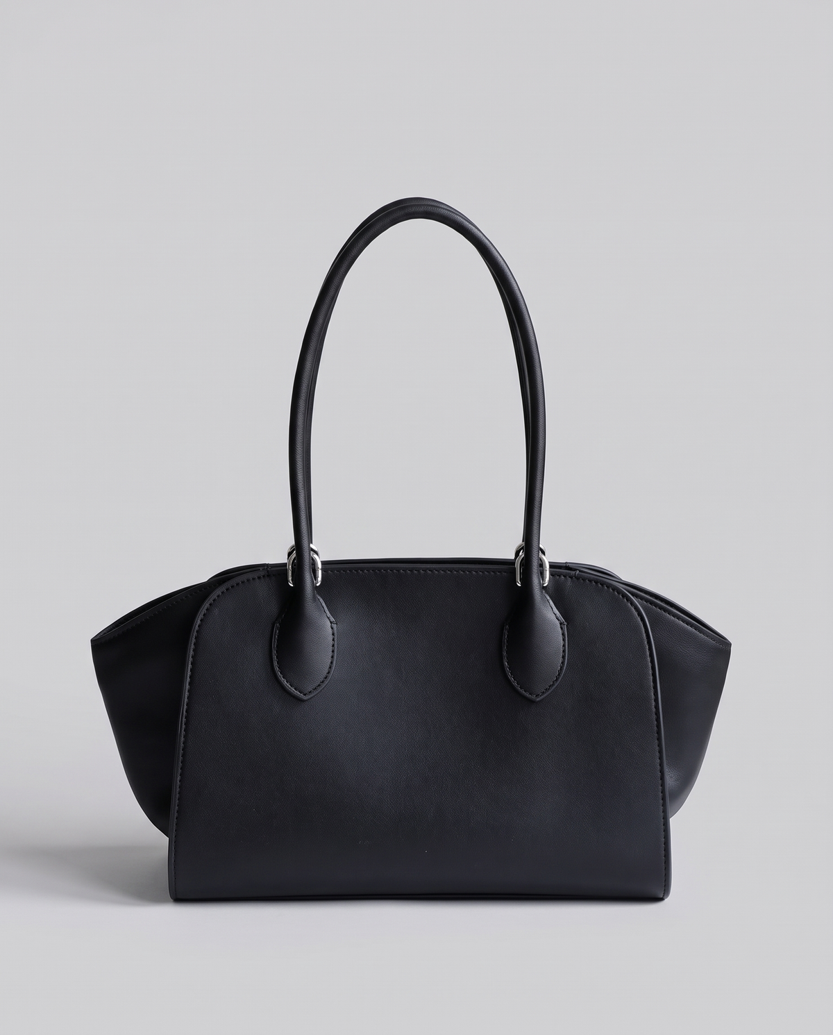 Hardware and handle detail on the Valentina Volta Large bag in Onyx