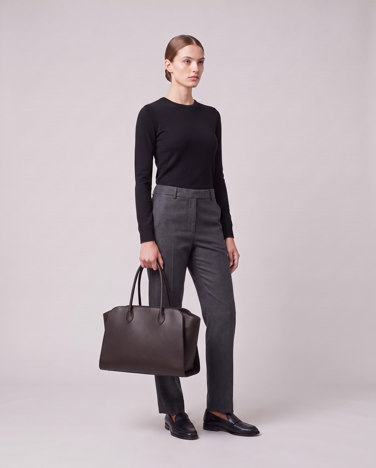 Model holding the Valentina Volta Small bag in Espresso, full length