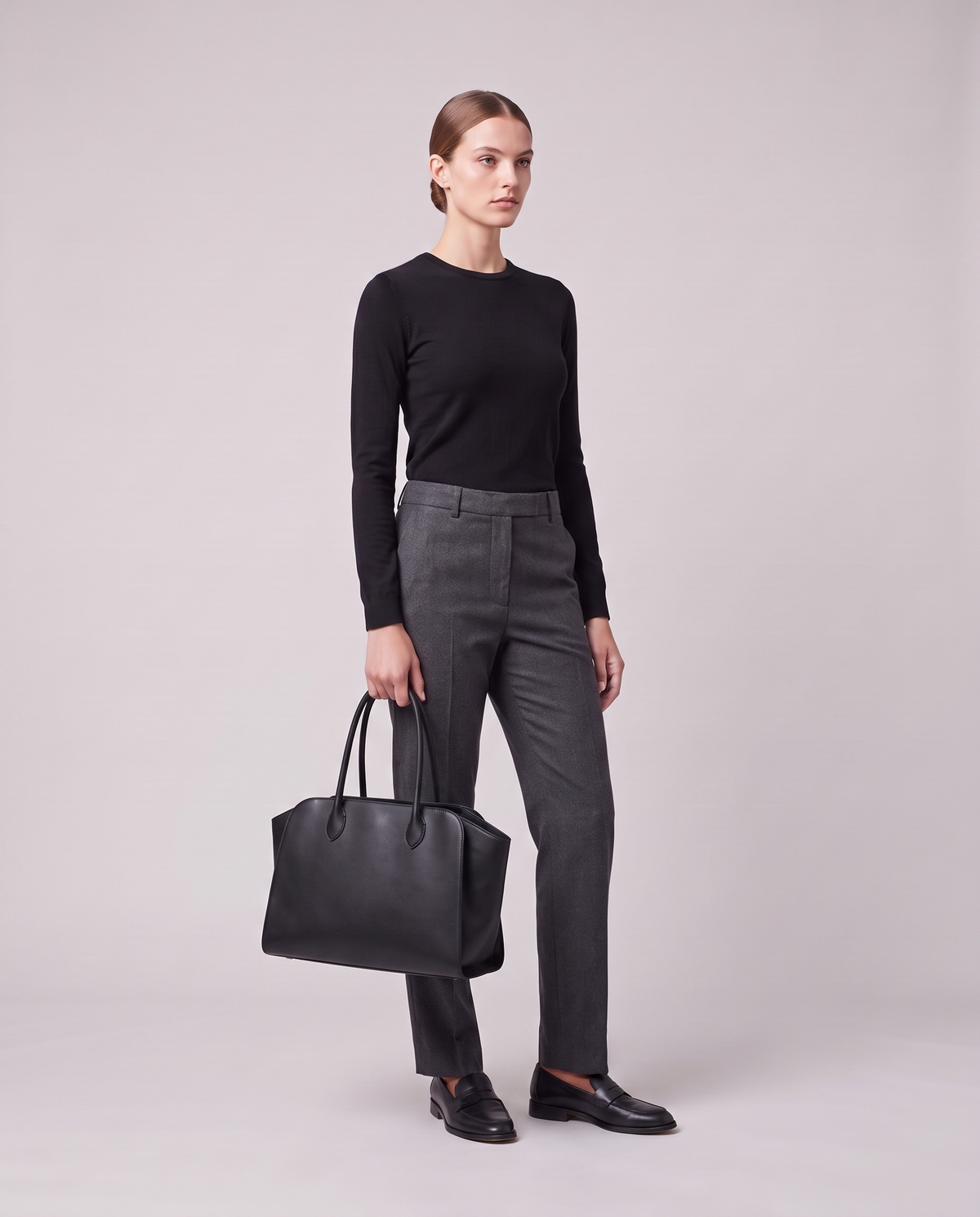 Model holding the Valentina Volta Small bag in Onyx, full length